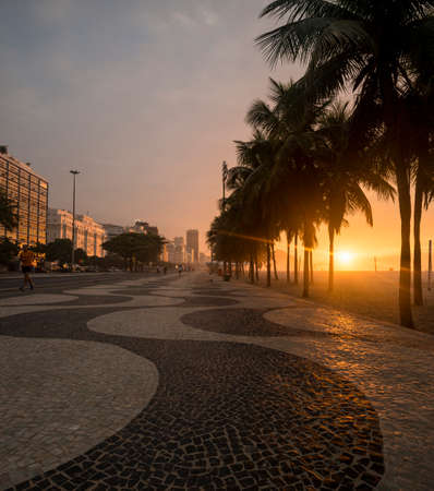 Sidewalk and palm trees, Copacabana beach at dawn, Rio De Janeiro, Brazilの写真素材
