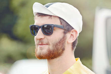 Cyclist wearing biking cap and sunglasses
