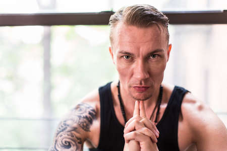 Man by windowの写真素材