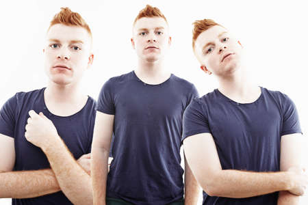 Three time multi exposure of young man staring