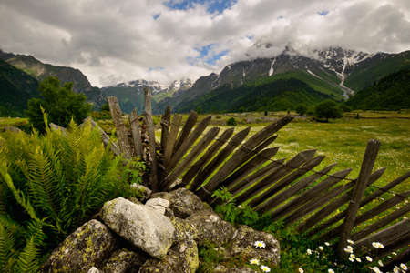 Fence and distant mountains, Mazeri village, Svaneti, Georgiaの写真素材