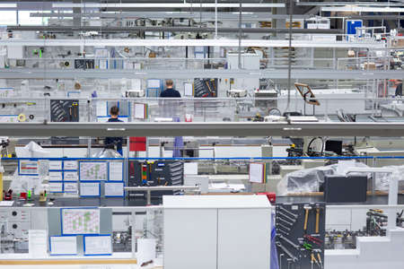 Two male workers in paper packaging factory