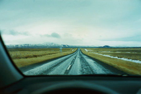 Straight rural road through car windscreen, Vesturland, Icelandの写真素材