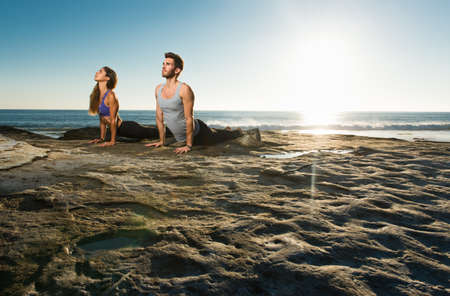 Upward dog yoga pose, Windansea beach, La Jolla, Californiaの写真素材