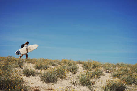 Woman with surfboard, Lacanau, Franceの写真素材