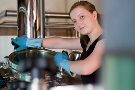 Female brewer working in brewhouse