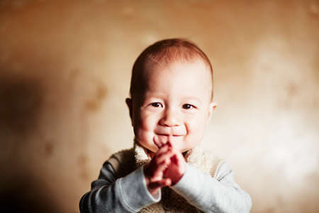 Portrait of cute baby boy smiling