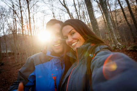 Hikers smiling in woods, Montseny, Barcelona, Catalonia, Spain
