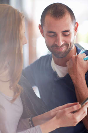 Couple looking at digital tablet