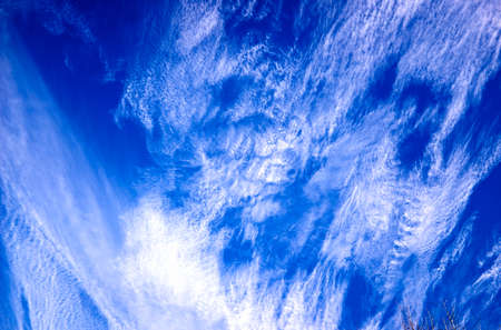 Low angle view of cirrus clouds and blue skyの写真素材