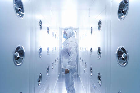 Worker wearing protective clothing in ecigarette factoryの写真素材