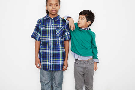 Boy leaning against friend's shoulder