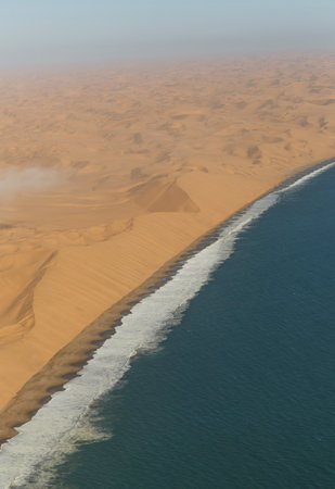 Aerial view of sea and dunes, Namib Desert, Namibiaの写真素材