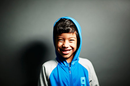 Boy wearing hooded topの写真素材