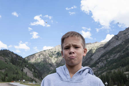 Portrait of teenage boy pulling a face, South Dakota, USA