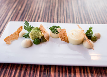 Parsley done in various ways with panna cotta and parsley chipsの写真素材