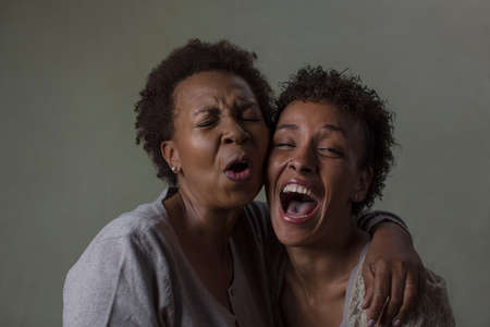 Studio portrait of two mature women laughingの写真素材