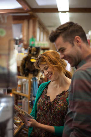 Man and woman shopping in health food storeの写真素材