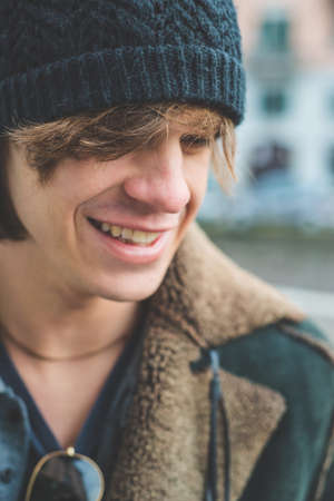 Man standing by canalの写真素材