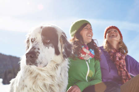 Female friends outdoors with dog