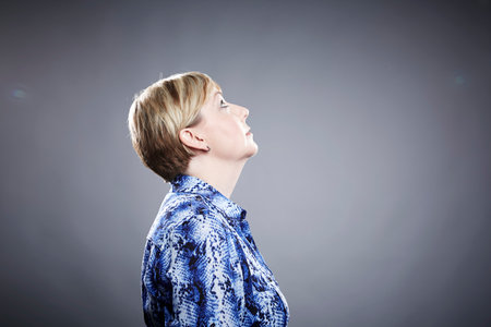 Profile of mature woman, looking upの写真素材