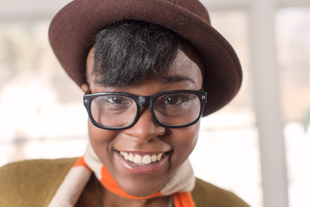 close up of pretty young woman smiling at cameraの写真素材