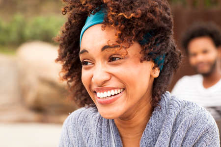 Close up of smiling young woman on Ipanema Beach, Rio De Janeiro, Brazilの写真素材