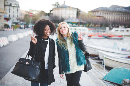 Portrait of two young female friends  at Lake Como, Como, Italyの写真素材