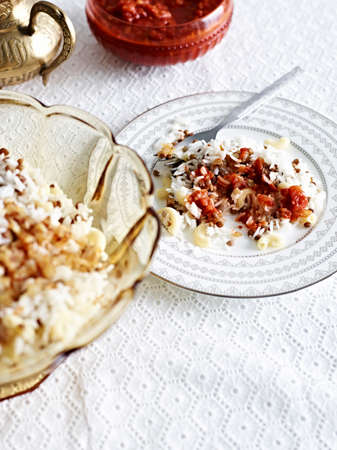 Still life with plate of rice salad and fried onionの写真素材