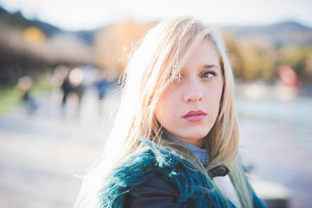 Portrait of young woman looking sideways in park
