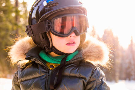 Close up portrait of boy wearing helmet and goggles, Nizhniy Tagil, Sverdlovsk Region, Russiaの写真素材