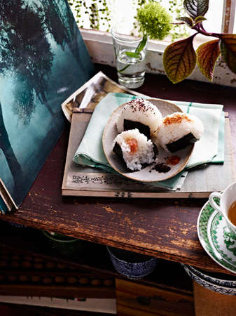 Still life of plate with shaped and wrapped onigiri