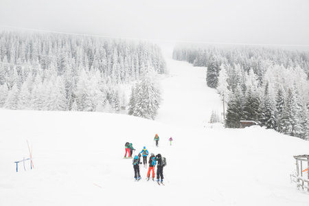 High angle view of skiers on ski slope, Tyrol, Austriaの写真素材