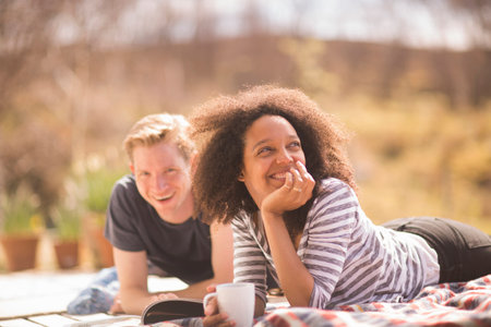 Mid adult couple relaxing outdoorsの写真素材