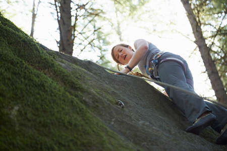 Rock climber scaling rockの写真素材