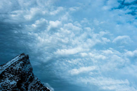 Detail of mountain top and storm clouds, Reine, Lofoten, Norwayの写真素材