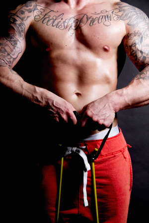 Young man using resistance bandの写真素材