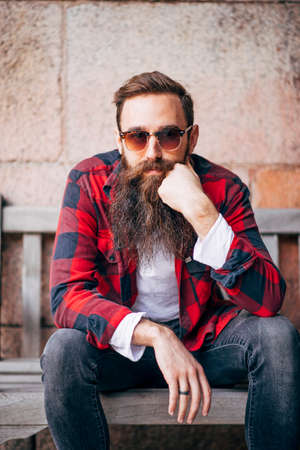 Portrait of man with beard wearing sunglasses