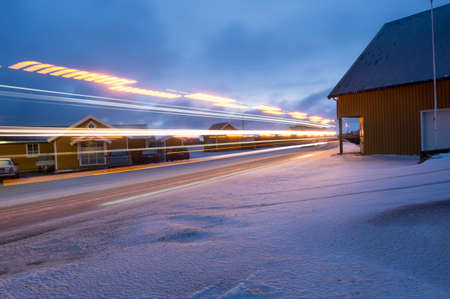 Road and buildings with motion blur, Reine, Lofoten, Norway