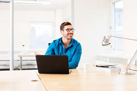 Young man using laptopの写真素材