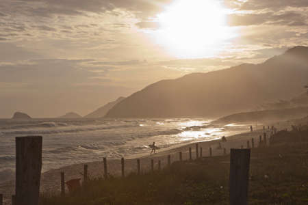 View of silhouetted beach at sunset, Rio De Janeiro, Brazilの写真素材