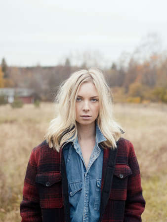 Portrait of young woman in rural setting