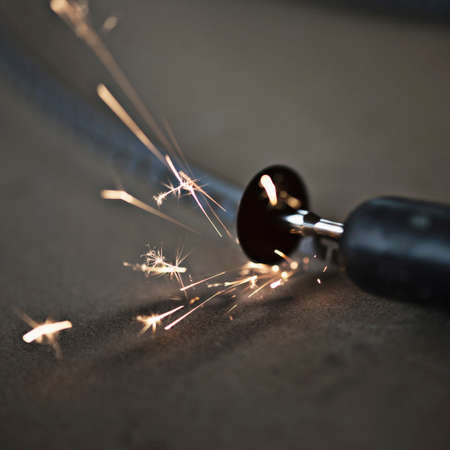 Small disc cutter creating sparks, close-up
