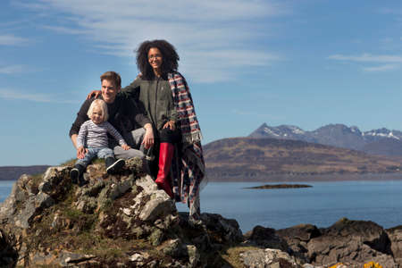 Family on rocks, Loch Eishort, Isle of Skye, Scotland