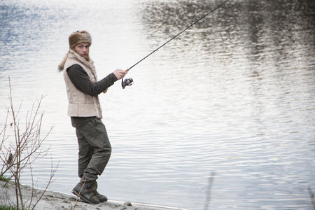 Mid adult man fishingの写真素材