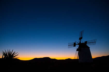 Silhouette of Molino de el Roque at dawn, Fuerteventura, Spainの写真素材