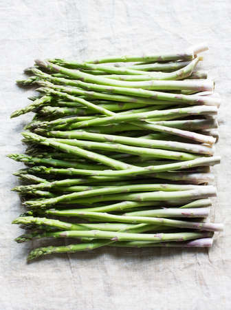Still life of asparagus bunch in a rowの写真素材