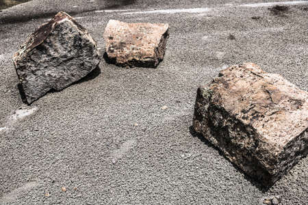 Three large rocks on the groundの写真素材