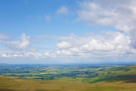 High angle view of rural landscape and blue cloudy sky, Cumbria, UKの写真素材