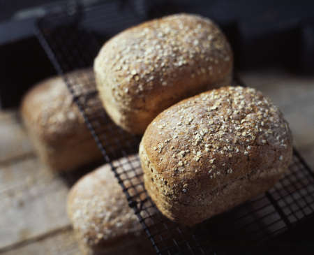 Organic bread with oats, on cooling rack, fresh from oven